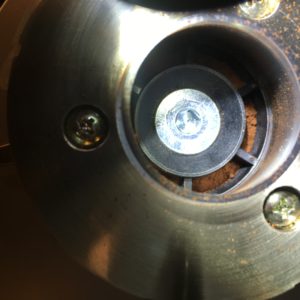 Peeking up into the burr set and impeller of the Sette